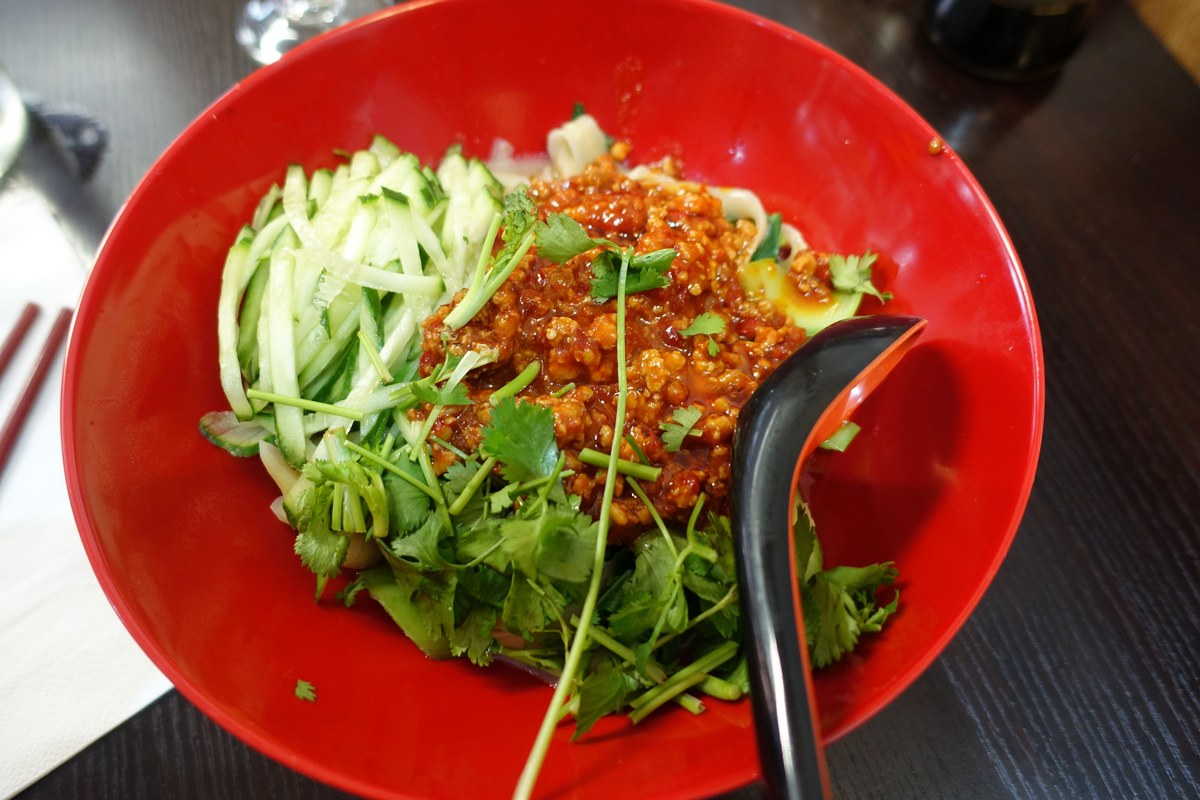 Beijing-style zha jiang mian noodles with fried sauce and vegetables.
