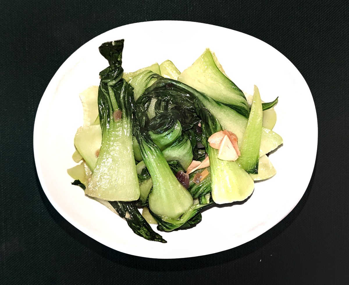 Cooked bok choy with mushrooms and ginger, matching a Chinese bok choy mushroom sauce.