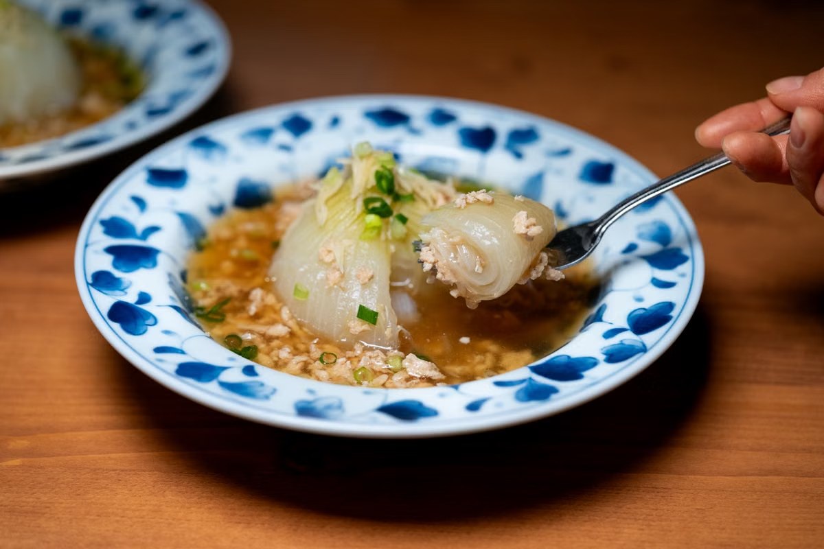 Chinese cabbage wedges in savory minced pork sauce with scallions.
