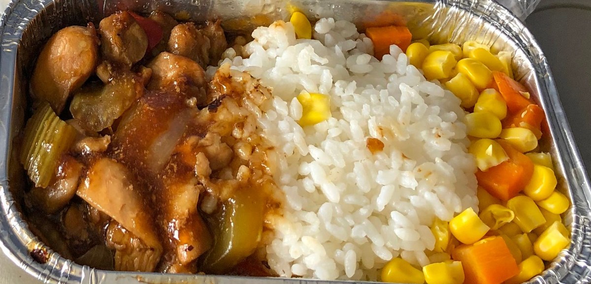Chinese chicken with black bean sauce served with rice.