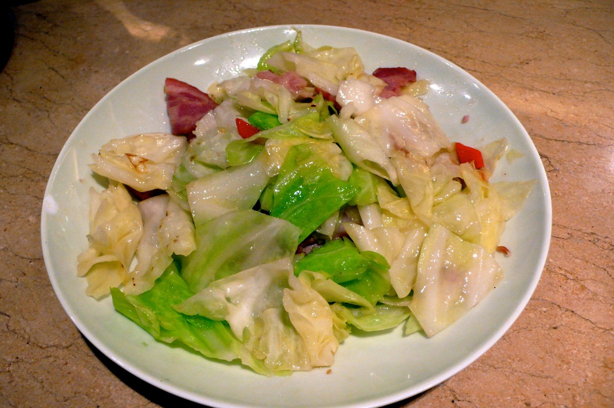 Chinese stir-fried cabbage with bacon and glossy wilted cabbage pieces.