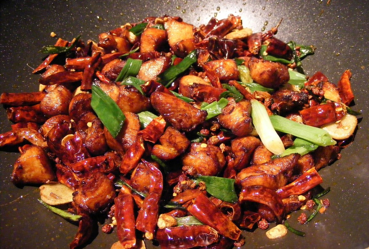 Chongqing chili chicken with crisp chicken pieces buried in dried red chiles.