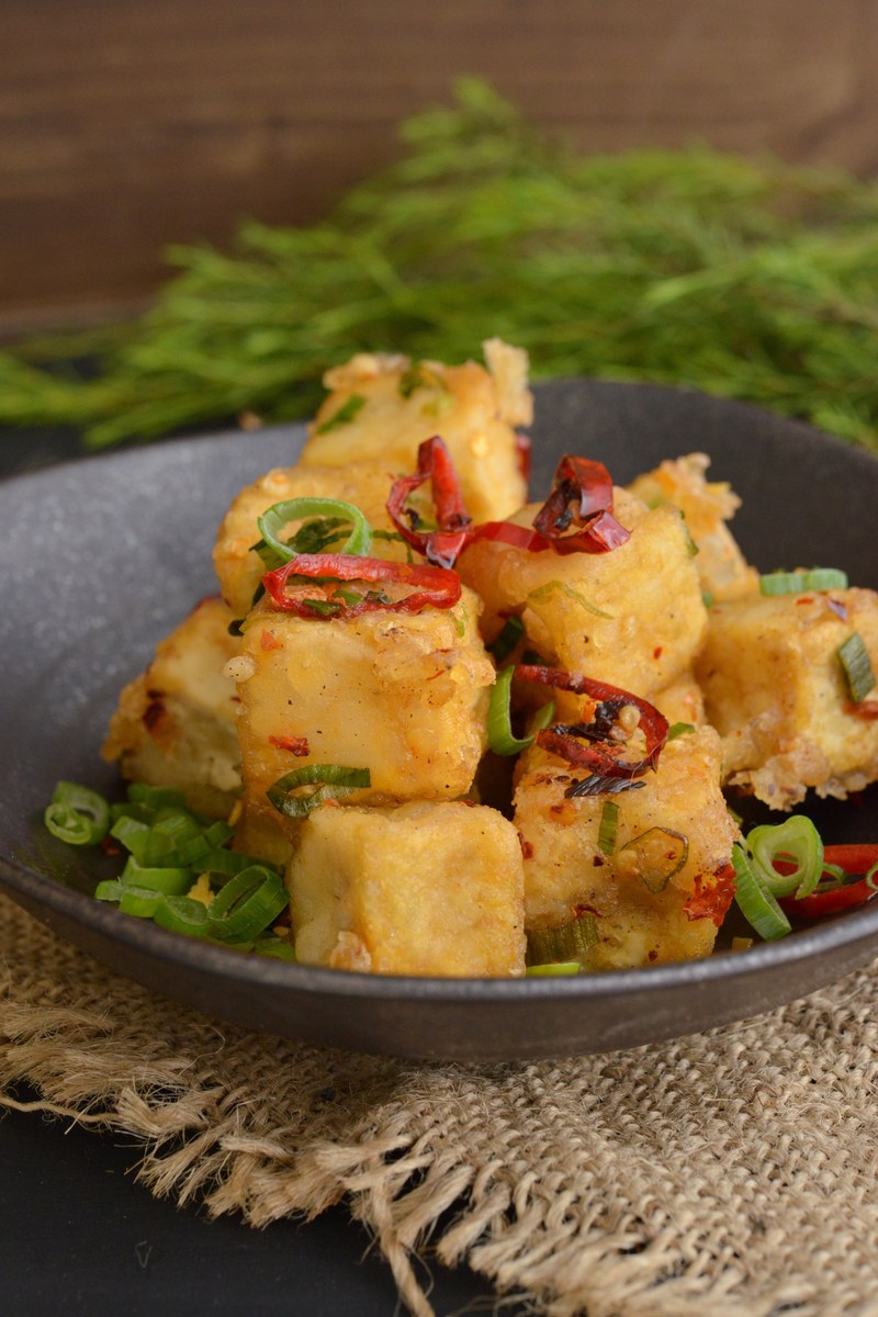 Crispy salt and pepper tofu cubes with chiles and scallions.