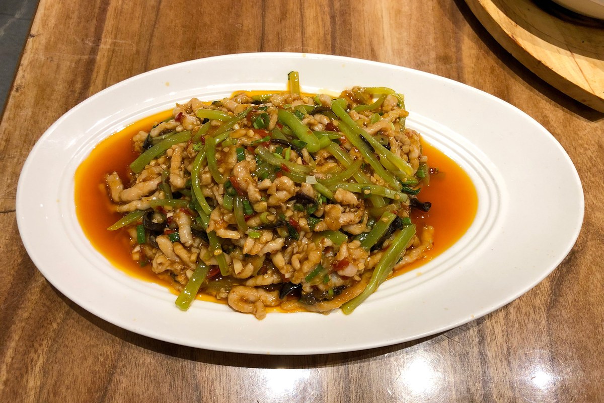 Fish-fragrant shredded pork with thin pork strips, vegetables, and glossy yu xiang sauce.