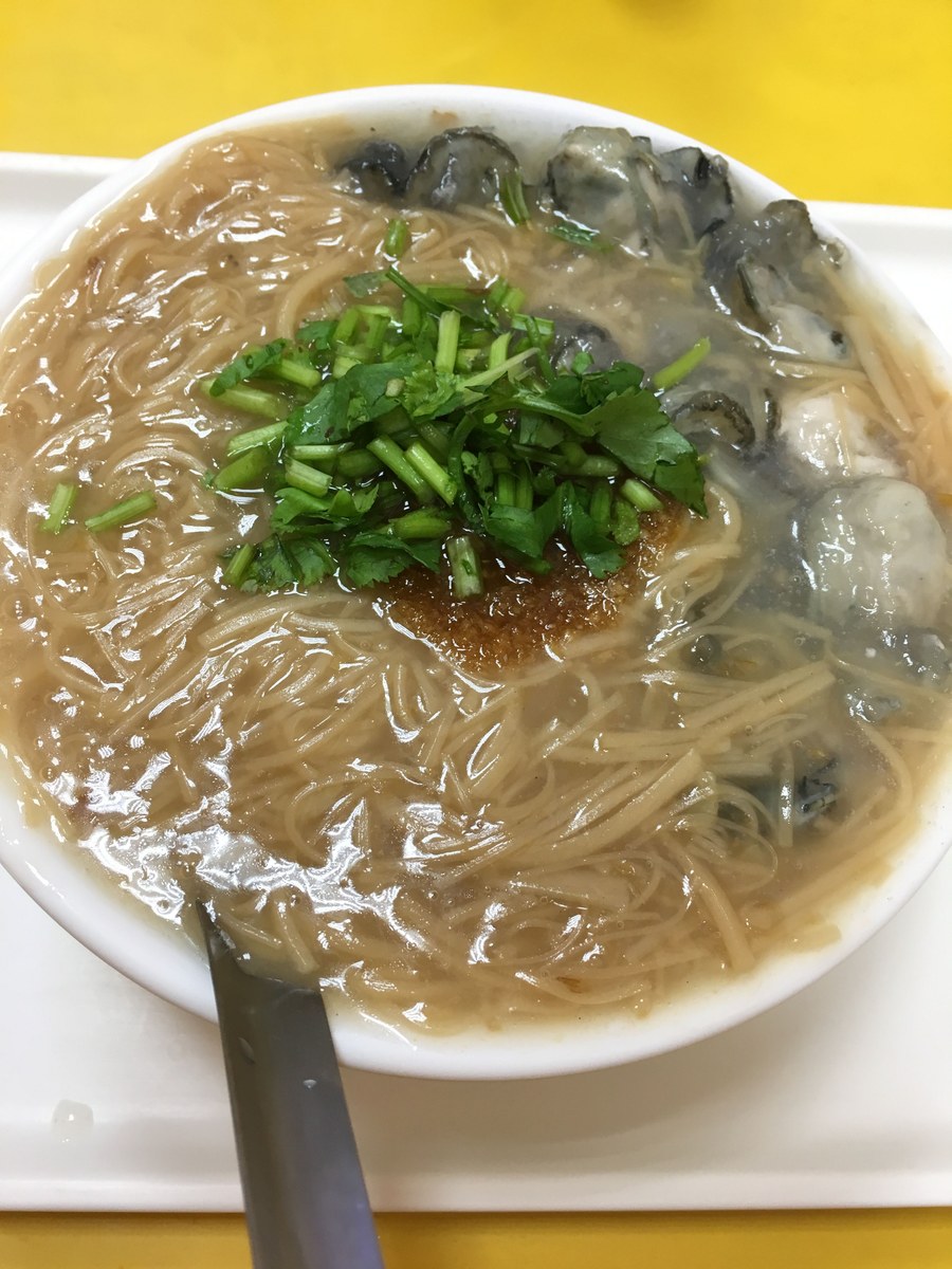 Oyster vermicelli with small oysters, thin wheat noodles, thick broth, and cilantro.