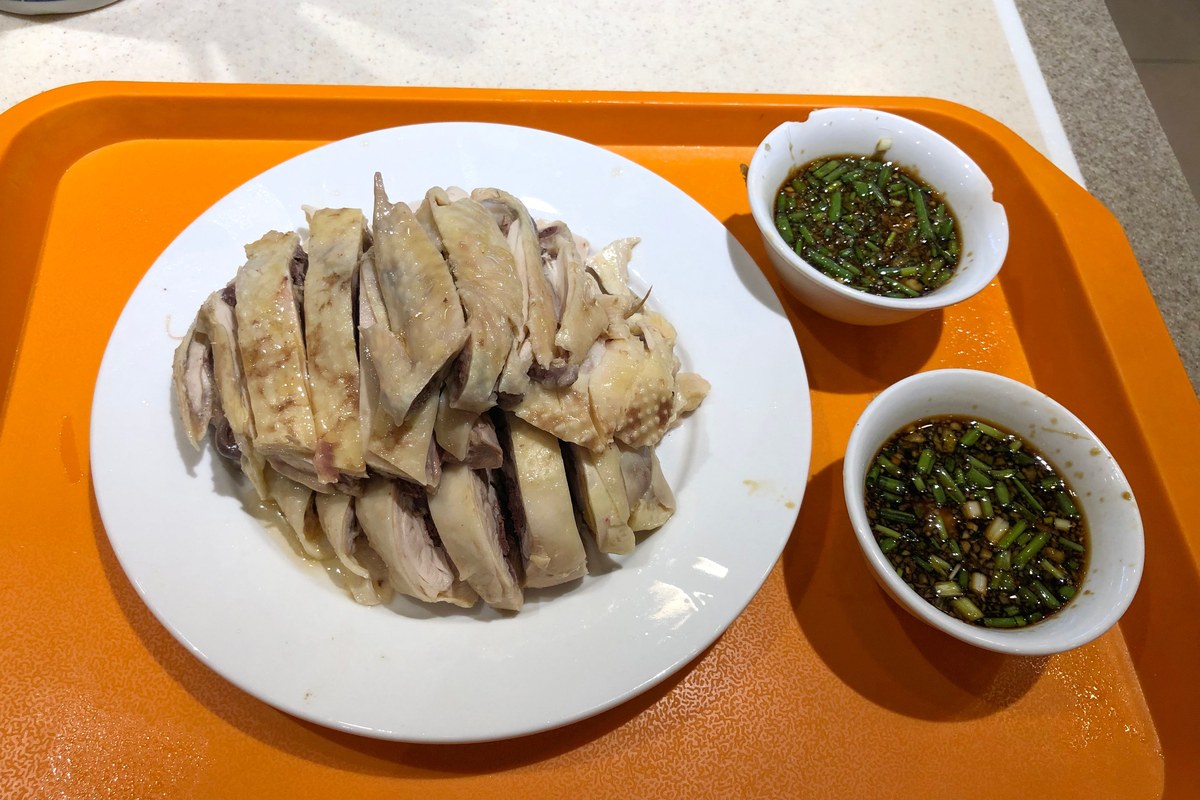 Cantonese white cut chicken served chopped with ginger scallion sauce.