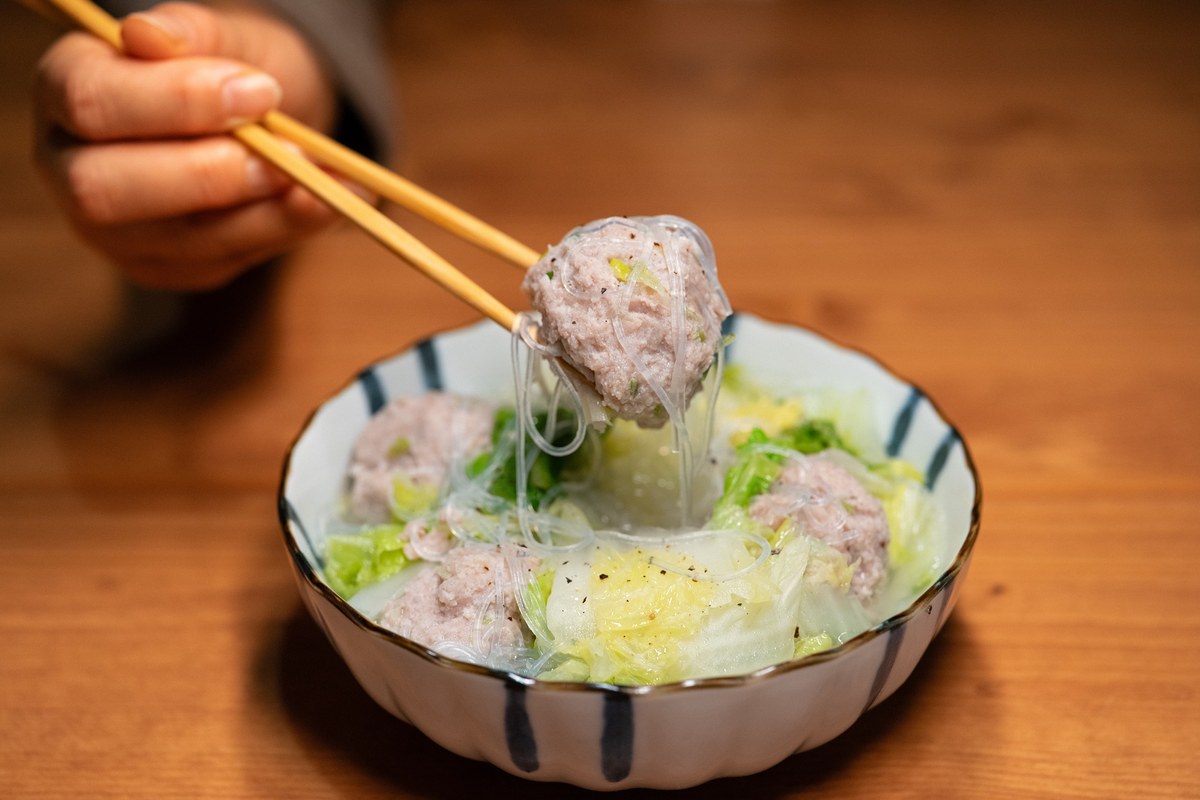 Lion head meatballs with large pork meatballs, vegetables, and savory braising broth.