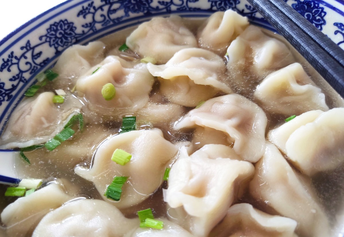 Northern Chinese lamb dumplings served on a restaurant plate.