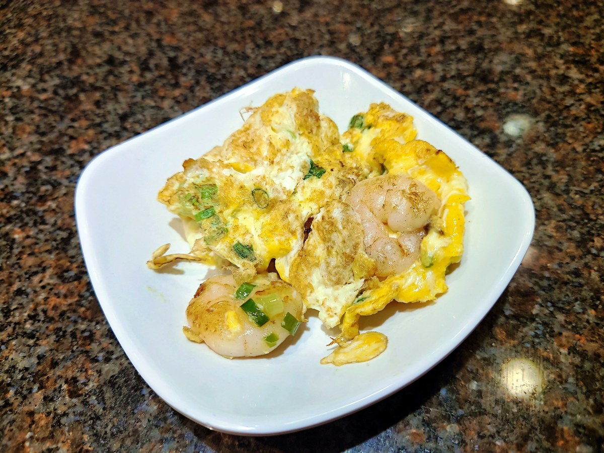 Cantonese shrimp and eggs with shrimp, soft egg curds, and scallions.