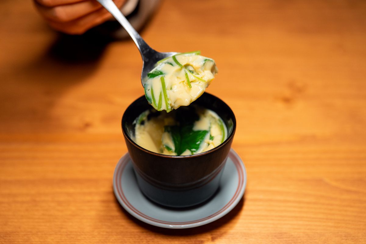 Scallion steamed egg custard cup with a smooth savory custard surface and soy-sesame finish.