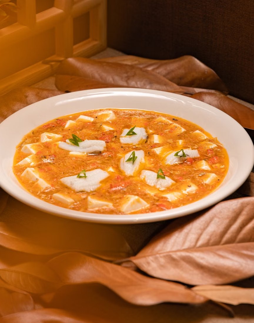 Tomato tofu egg drop soup with soft tofu cubes and silky egg ribbons.