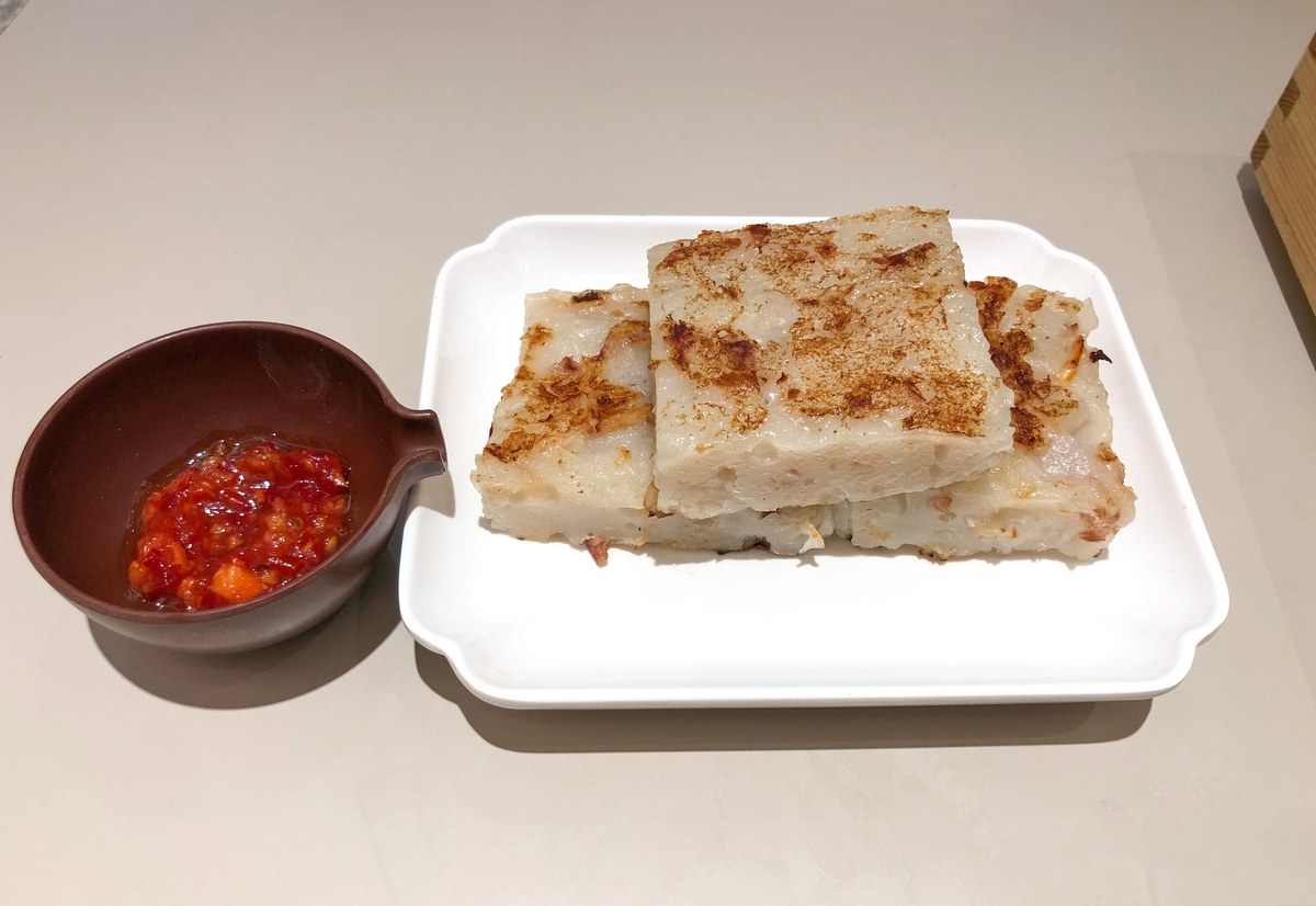 Pan-fried Cantonese turnip cake slices with crisp golden edges.
